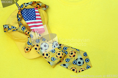 Image of Yellow Baseball Cap, Necktie and US Flag