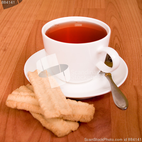 Image of cup of tea and some cookies