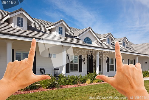 Image of Female Hands Framing Beautiful House