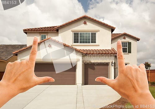 Image of Female Hands Framing Beautiful House