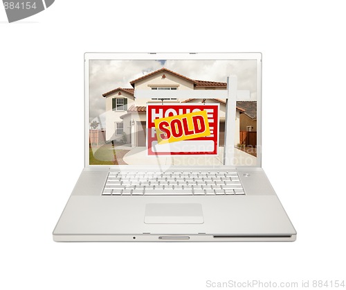Image of Sold For Sale Real Estate Sign on Laptop 