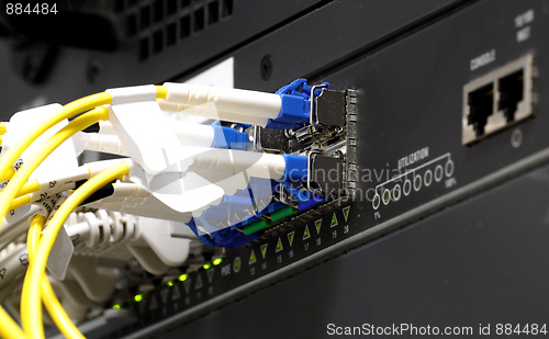 Image of back side of switch with fiber optic ports