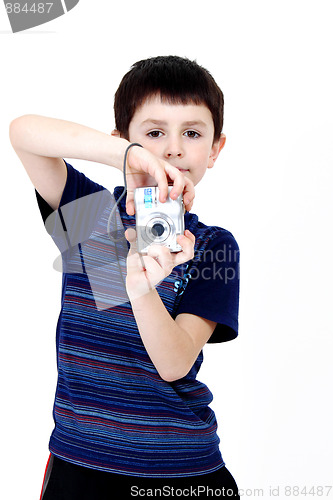 Image of Young boy with digital camera