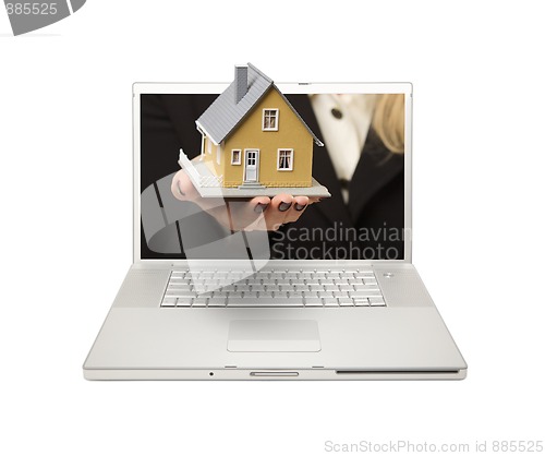 Image of Woman Handing House Through Laptop Screen