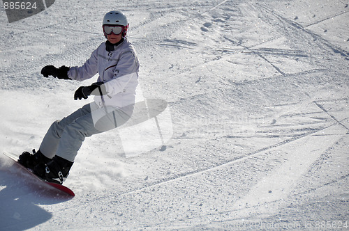 Image of Female snowboarder in powder snow