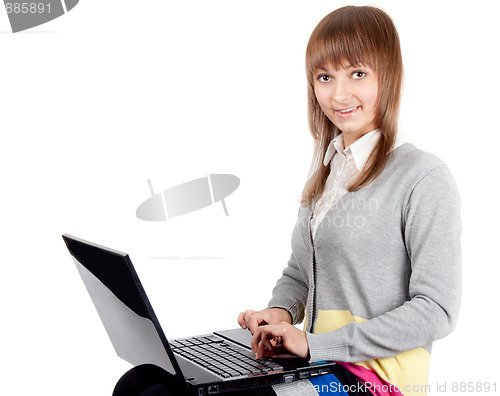 Image of Young beautiful girl with computer