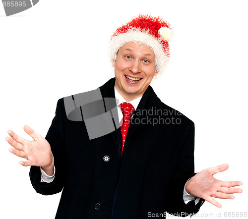 Image of Man in suit and red tie in hat santa
