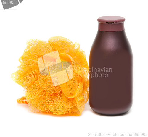Image of Vial of the shampoo and yellow sponge