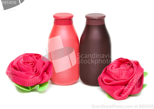 Image of Two vials of the shampoo and sponge in form of the rose