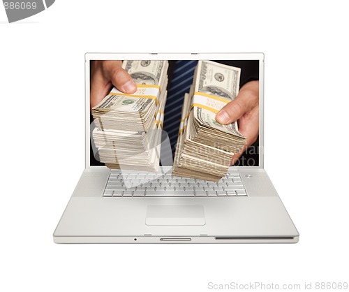 Image of Man Handing Stacks of Money Through Laptop Screen