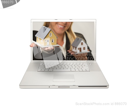 Image of Woman Handing House Through Laptop Screen