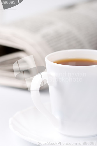 Image of cup of coffee and newspapers