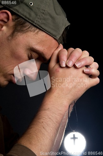 Image of Praying Man Holding A Cross -2