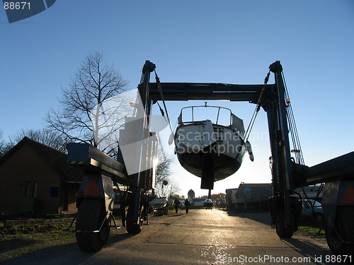 Image of Boat on crane