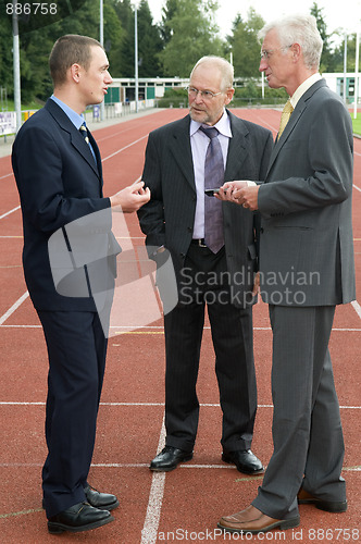 Image of Discussing On A Racetrack -2