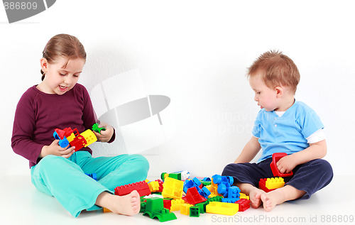 Image of Adorable kids playing with blocks