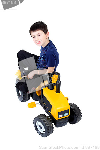 Image of small boy on the yellow tractor