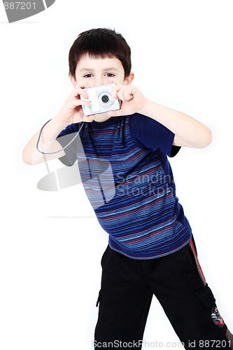 Image of Young boy with digital camera prepare for shooting