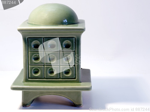 Image of Miniature model of a tiled stove on white