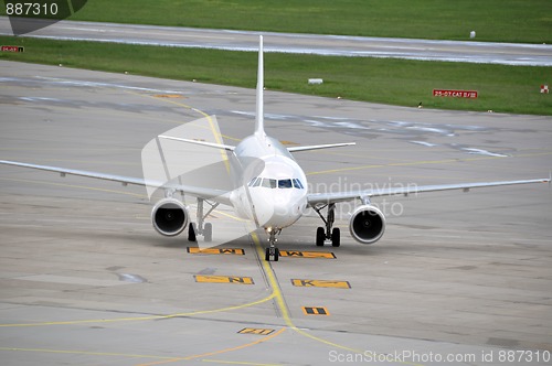 Image of Airplane taxiing at large airport