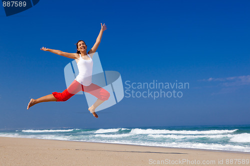 Image of Young woman jumping