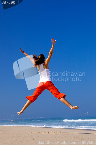 Image of Young woman jumping