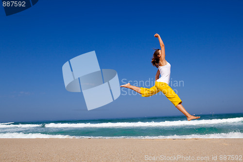 Image of Young woman jumping