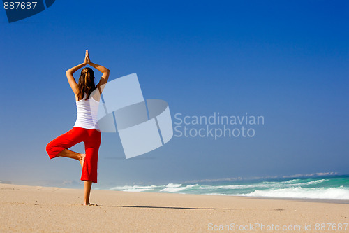 Image of Young woman making Yoga