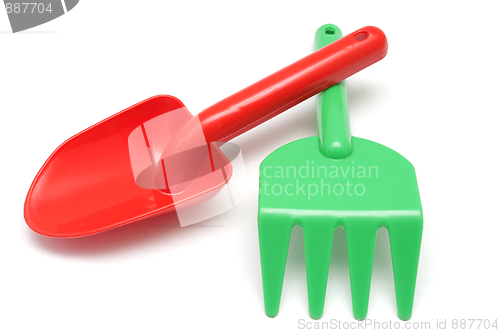 Image of Red shovel and green rake toys