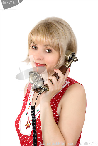 Image of The beautiful woman with ancient phone
