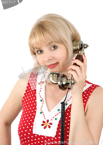 Image of The beautiful woman with ancient phone