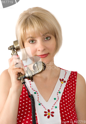 Image of The beautiful woman with ancient phone