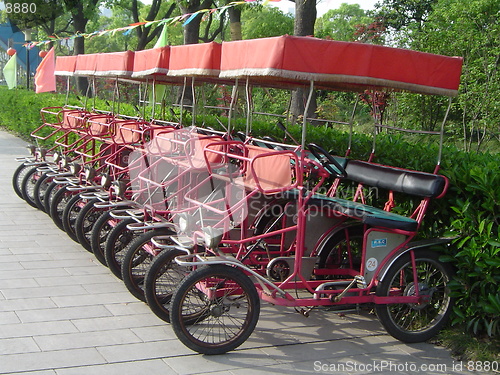 Image of Line of Red Pedal Cars