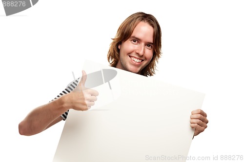 Image of Smiling Young Man with Thumbs Up Holding Blank White Sign