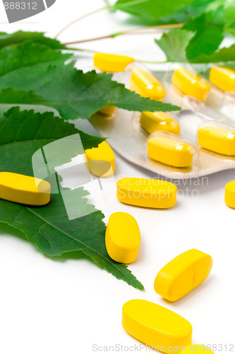 Image of yellow vitamin pills