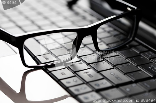 Image of glasses on laptop