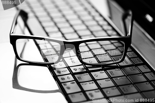 Image of glasses on laptop