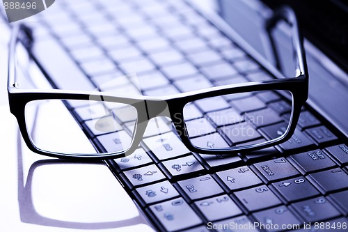 Image of glasses on laptop