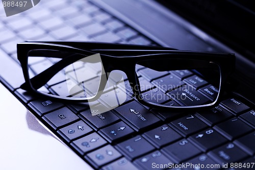 Image of glasses on laptop