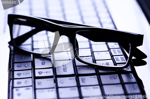 Image of glasses on laptop