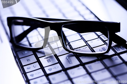 Image of glasses on laptop