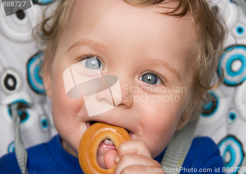 Image of baby boy with bread ring