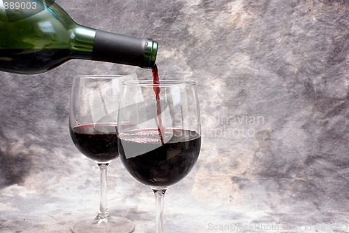 Image of pouring red wine with copy space