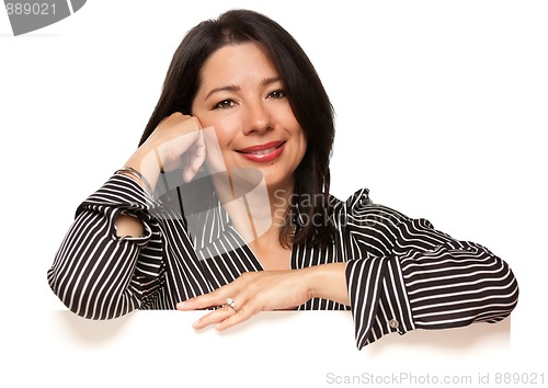 Image of Attractive Multiethnic Woman Leaning on Blank White Sign Corner