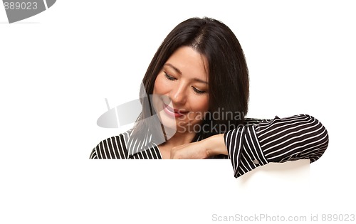 Image of Attractive Multiethnic Woman Looking Down to Blank White Sign