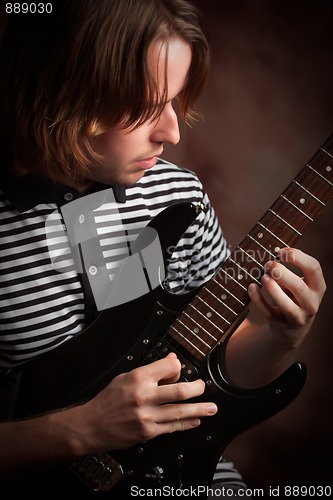Image of Young Musician Plays His Electric Guitar