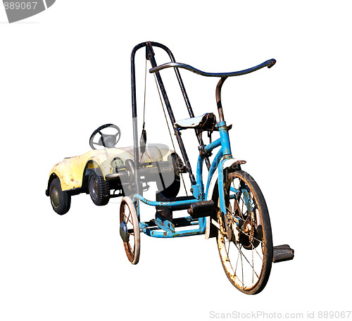 Image of Trike with a Toy Car in Tow 