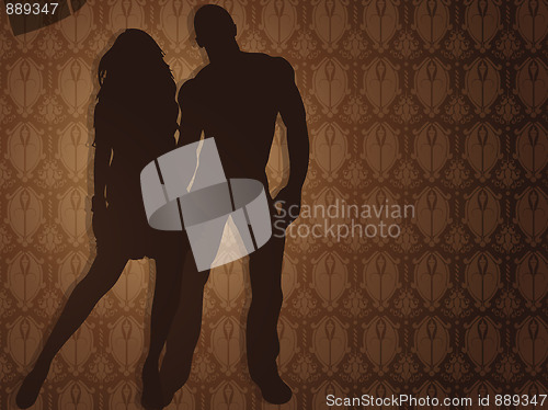 Image of Sexy couple against damask background. 