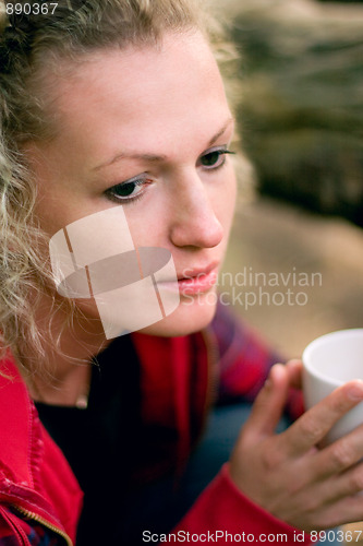 Image of woman holding a cup