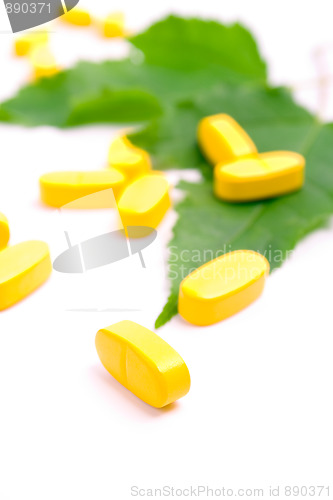 Image of yellow vitamin pills